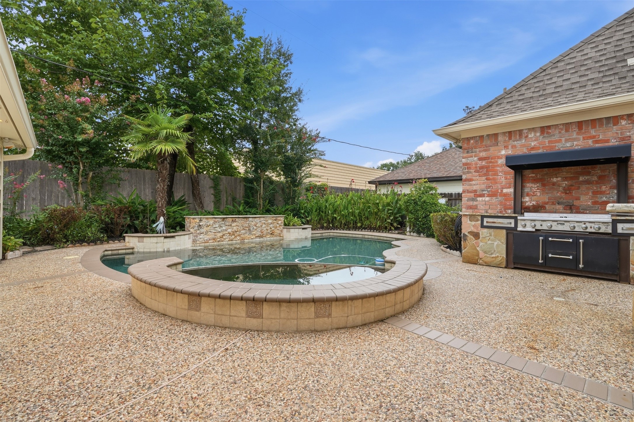 8310 Mentmore Drive Spring, TX 77379 - Photo 6 of 47 The beautifully designed backyard offers the perfect combination of recreation, relaxation, and privacy.