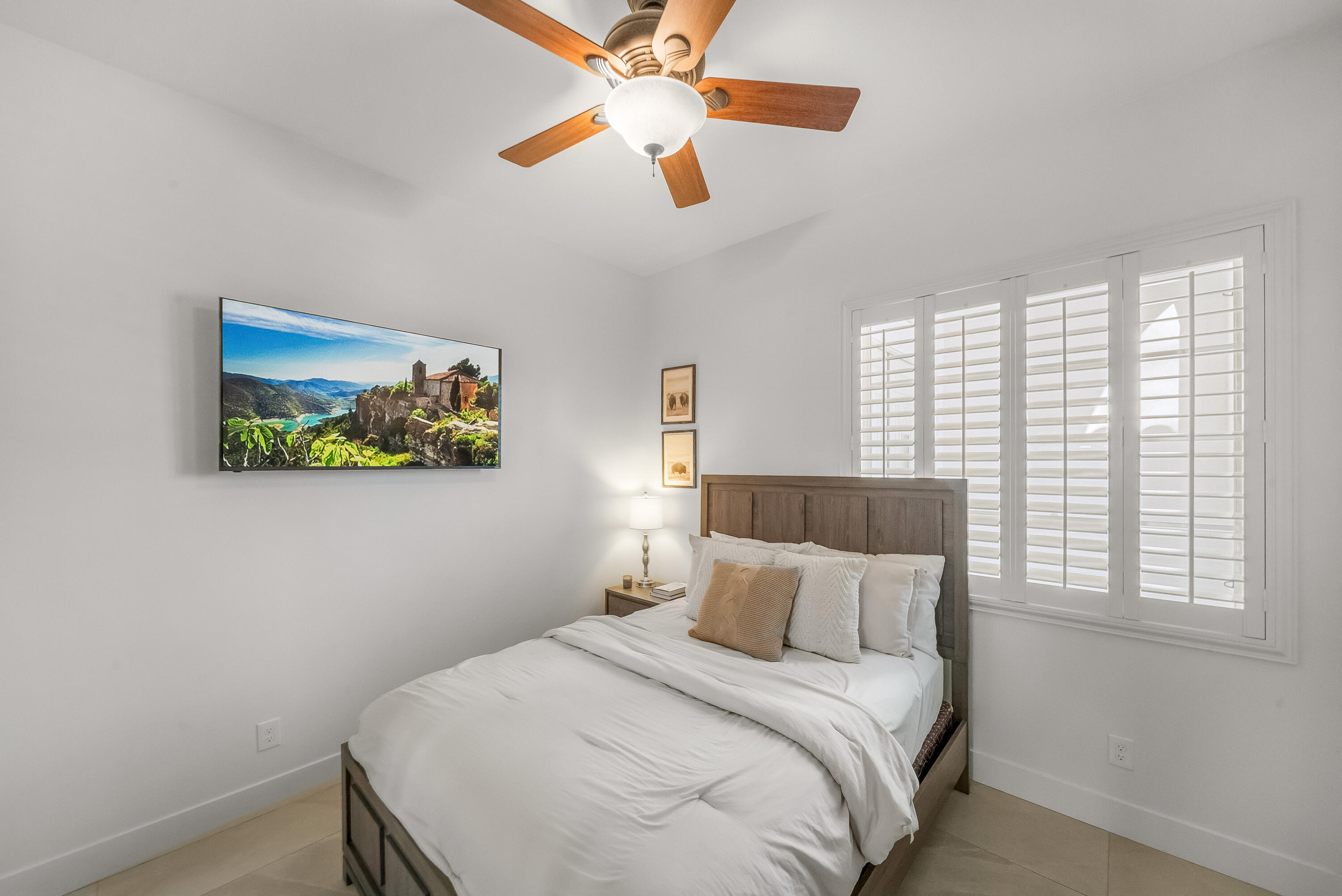 80262 Amazon Avenue Indio, CA 92201 - Photo 40 of 69 a bedroom with a bed and a painting on the wall