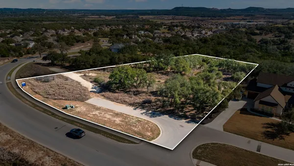 a view of a house with a yard and fountain
