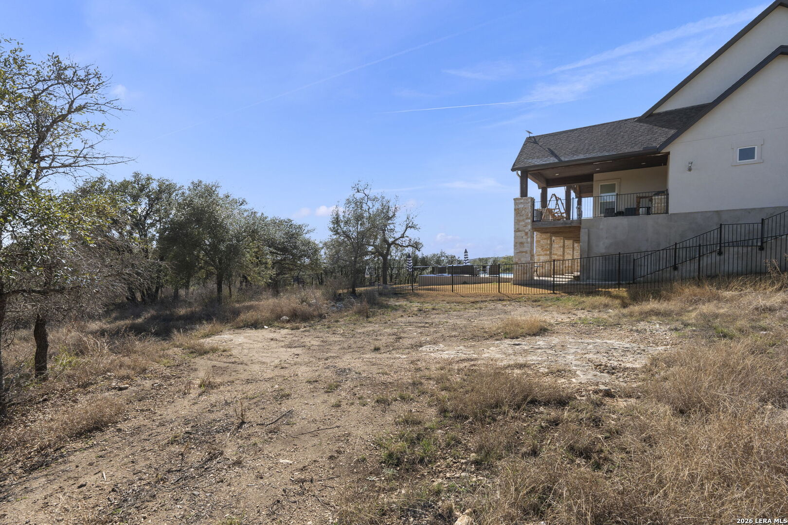 31045 Johnson Way Bulverde, TX 78163 - Photo 13 of 19 a view of a house with a yard