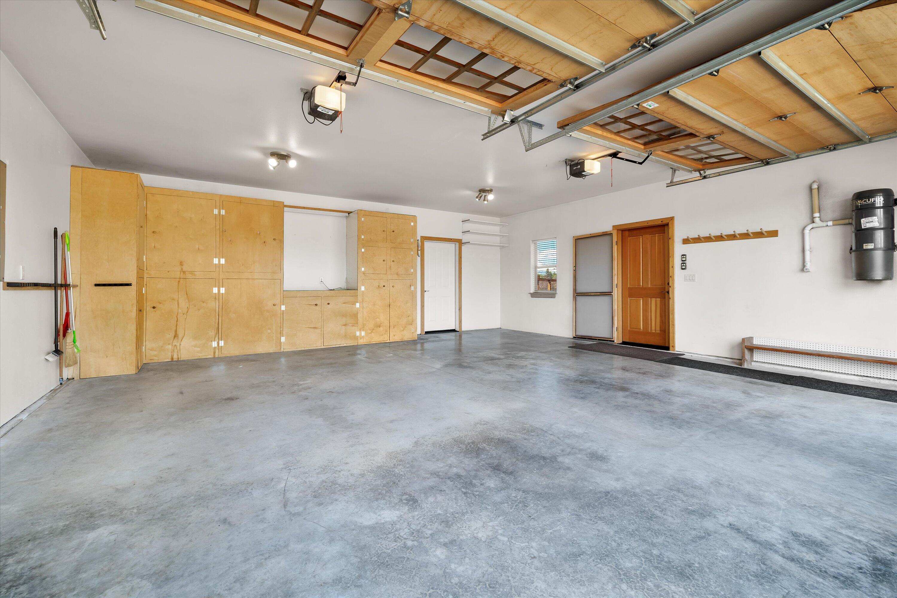 69125 Hurtley Ranch Road Sisters, OR 97759 - Photo 47 of 77 Attached garage with heated workshop and a spacious entertainment loft, complete with pool table, perfect for game nights and casual gatherings.
