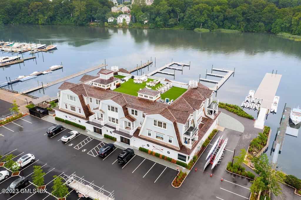 an aerial view of a house with outdoor space and lake view