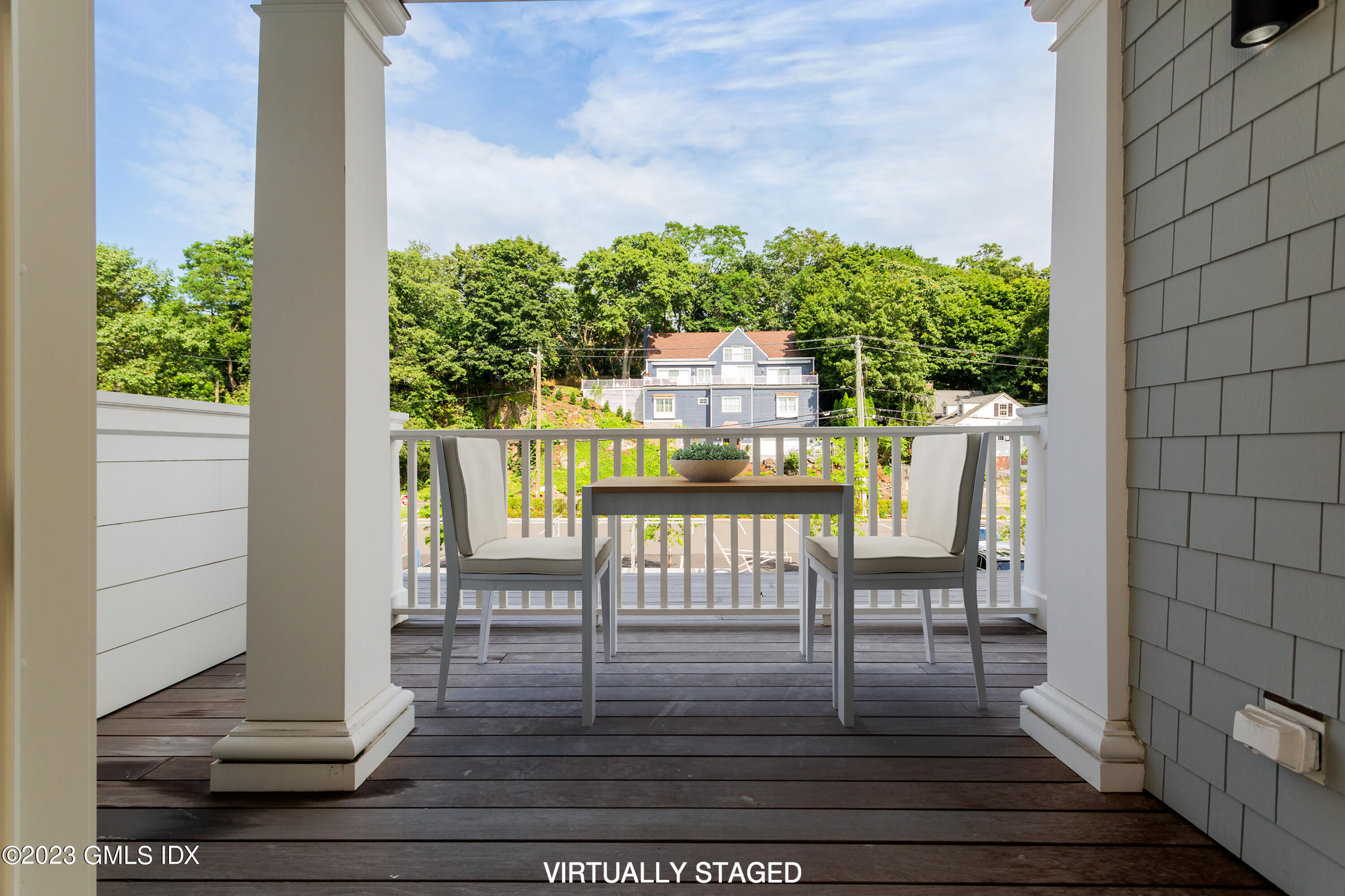 89 River Road, Unit 203 Cos Cob, CT 06807 - Photo 16 of 27 a view of balcony with wooden floor
