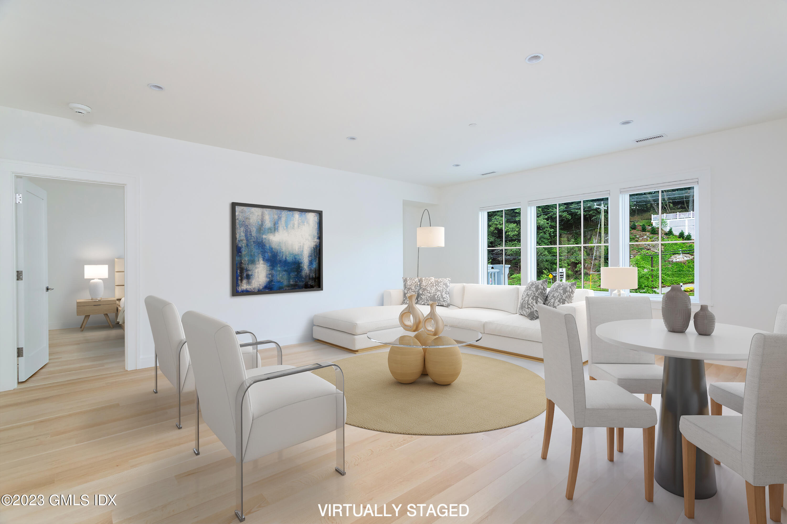 89 River Road, Unit 203 Cos Cob, CT 06807 - Photo 6 of 27 a living room with furniture and a large window