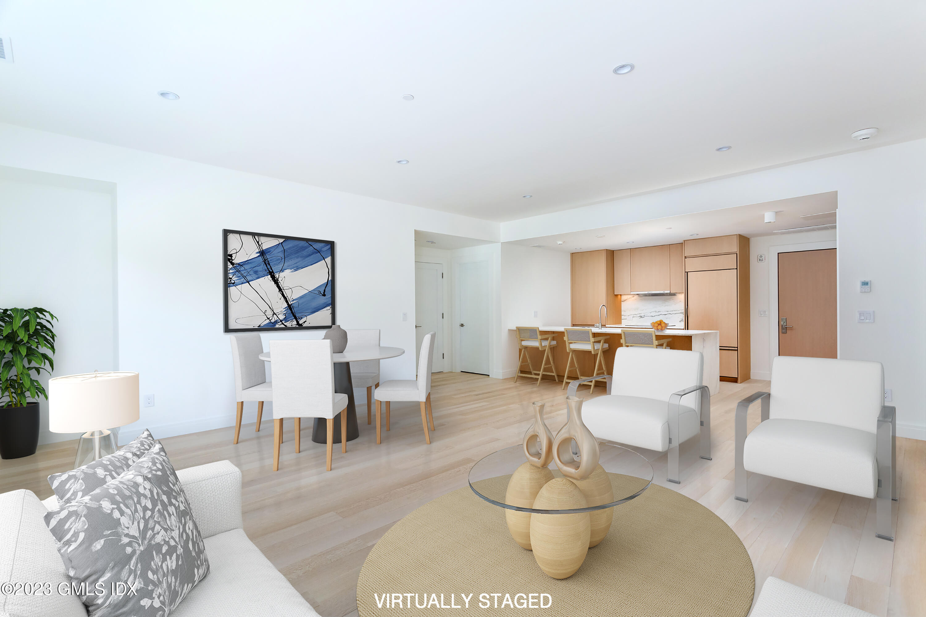 89 River Road, Unit 203 Cos Cob, CT 06807 - Photo 9 of 27 a living room with furniture couches and a dining table with wooden floor