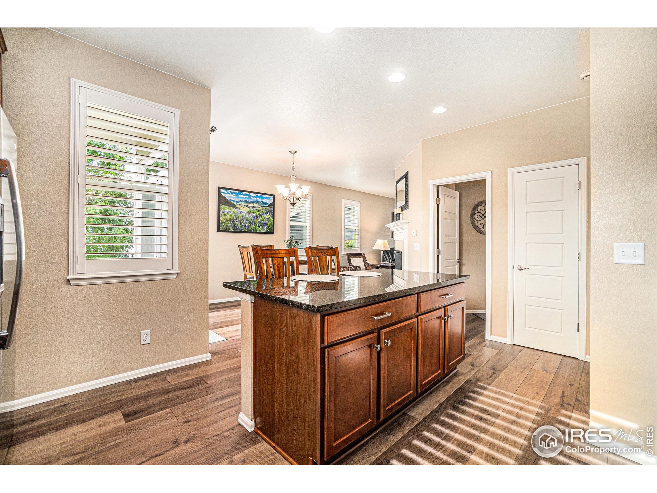 5622 Foxfire Street Timnath, CO 80547 - Photo 11 of 34 a bathroom with a sink a mirror and a shower