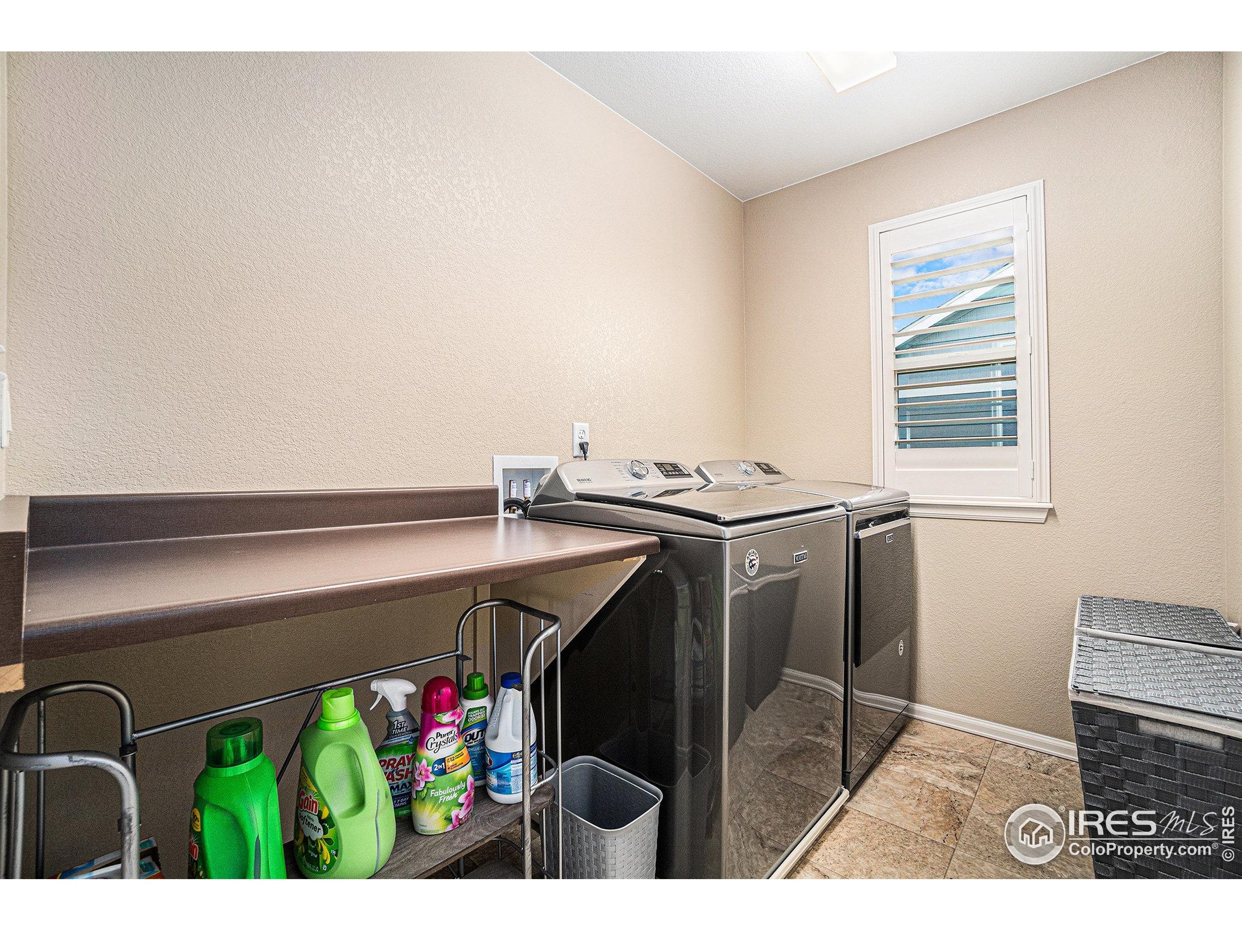 5622 Foxfire Street Timnath, CO 80547 - Photo 25 of 34 a utility room with dryer and washer