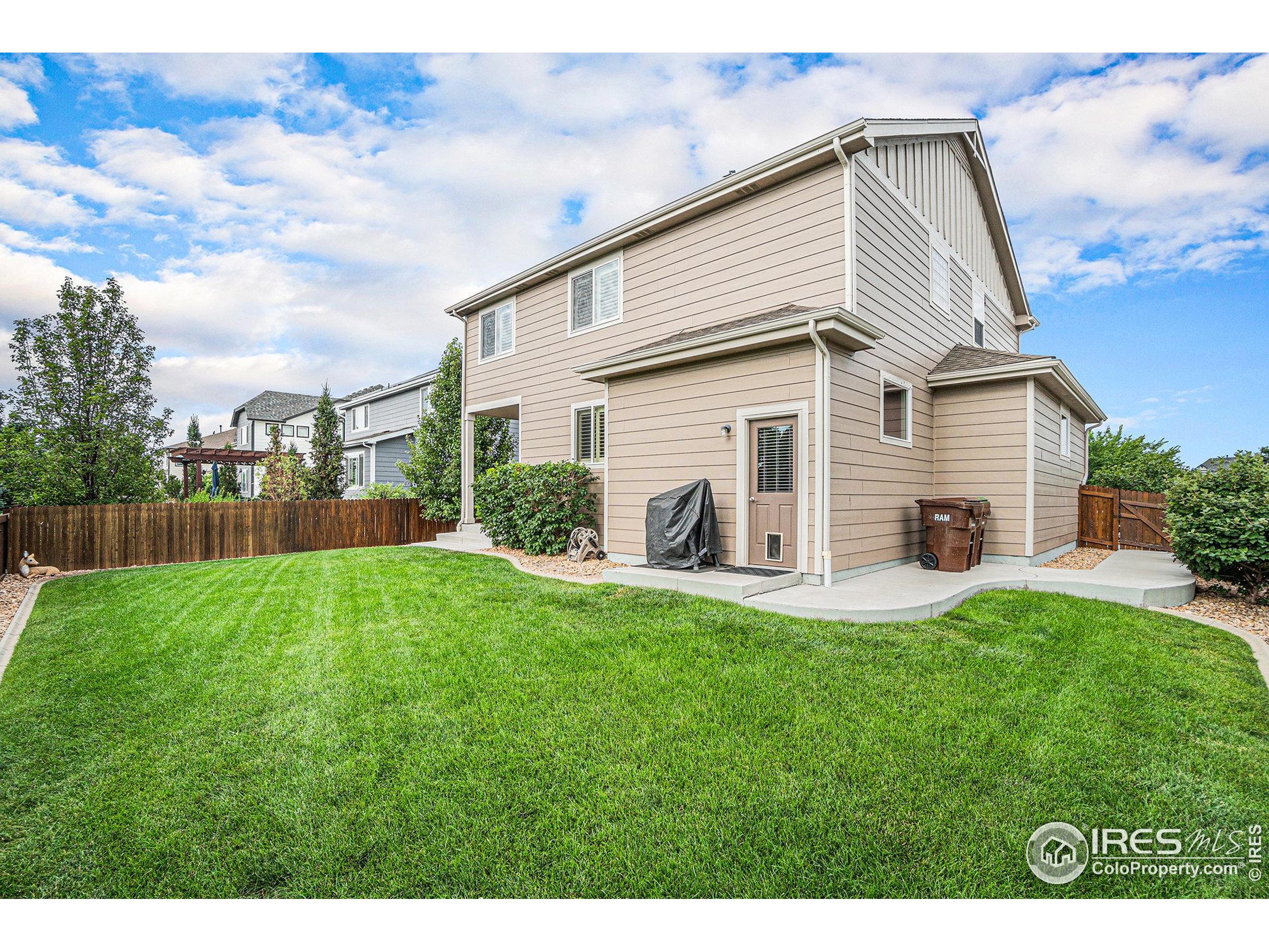 5622 Foxfire Street Timnath, CO 80547 - Photo 28 of 34 a front view of house with yard and green space