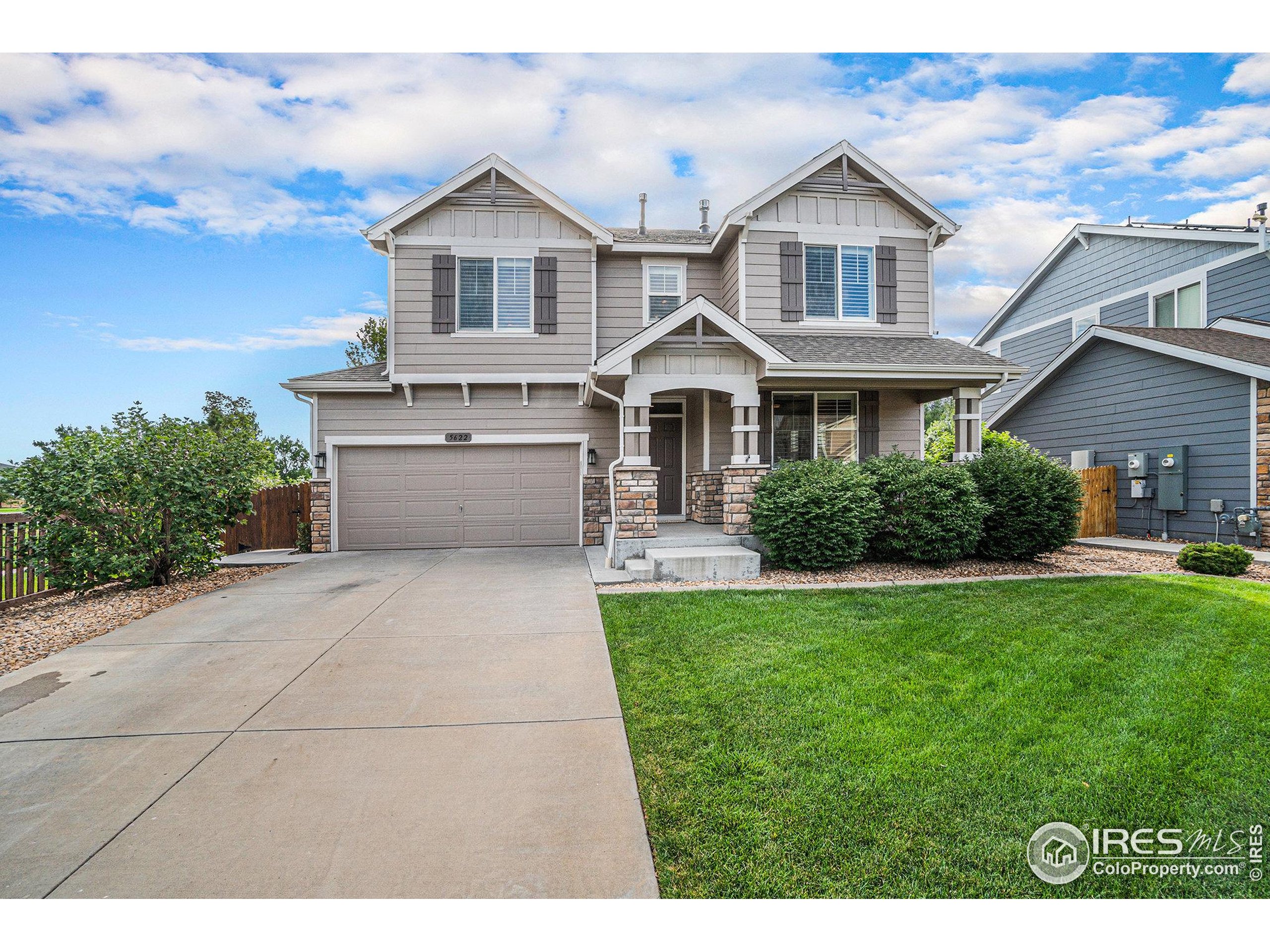 5622 Foxfire Street Timnath, CO 80547 - Photo 33 of 34 a front view of a house with a yard