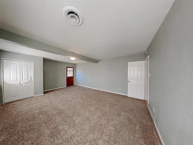 a view of an empty room and window