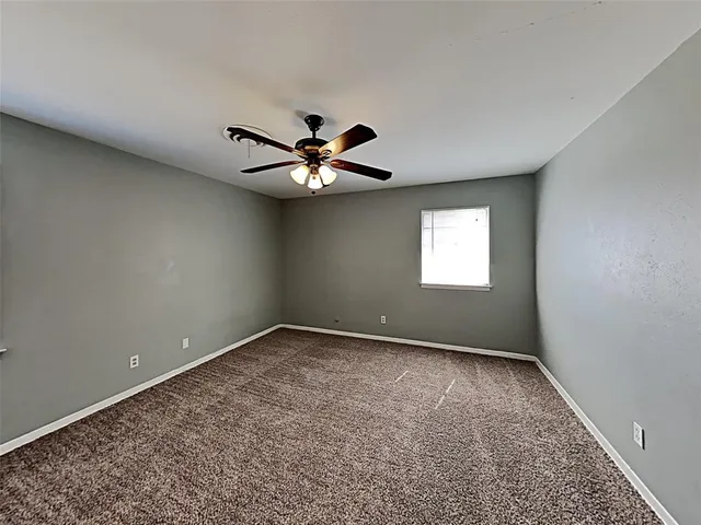 a kitchen with a sink a stove and cabinets