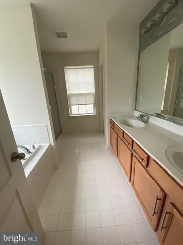 a bathroom with a sink a vanity and a mirror