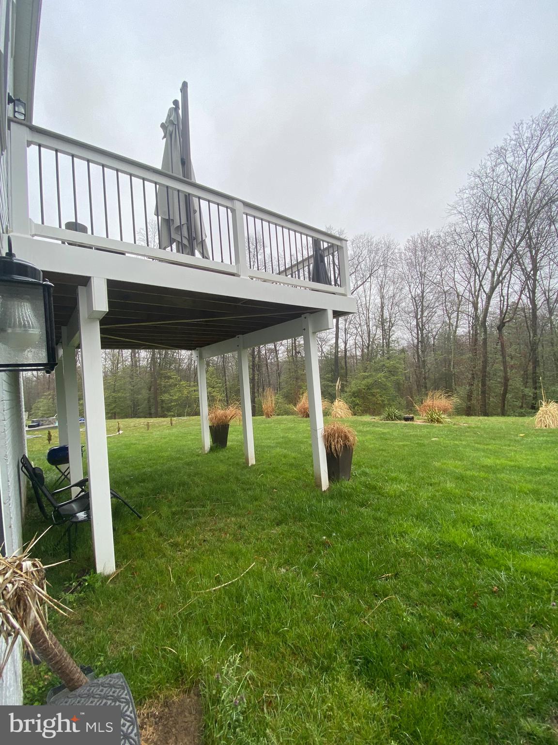 918 Ramble Run Road Baltimore, MD 21220 - Photo 22 of 23 a view of a house with a yard and deck