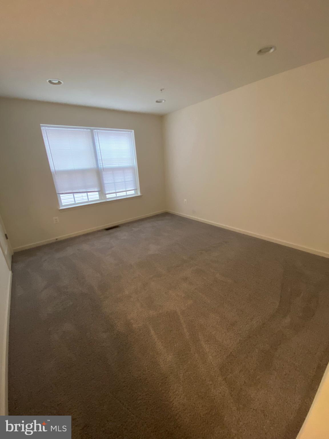 918 Ramble Run Road Baltimore, MD 21220 - Photo 8 of 23 an empty room with a window