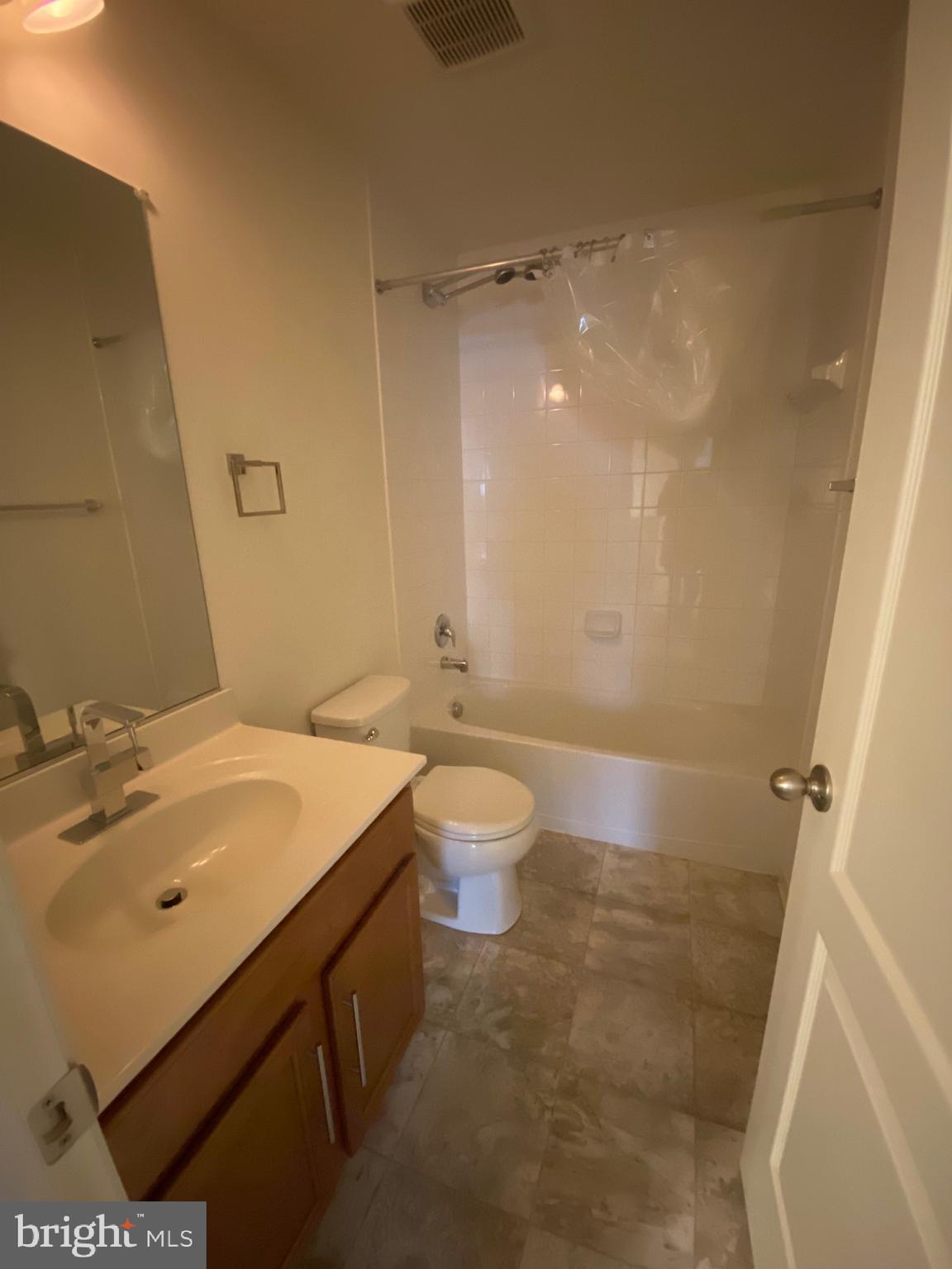 918 Ramble Run Road Baltimore, MD 21220 - Photo 10 of 23 a bathroom with a sink a toilet and shower