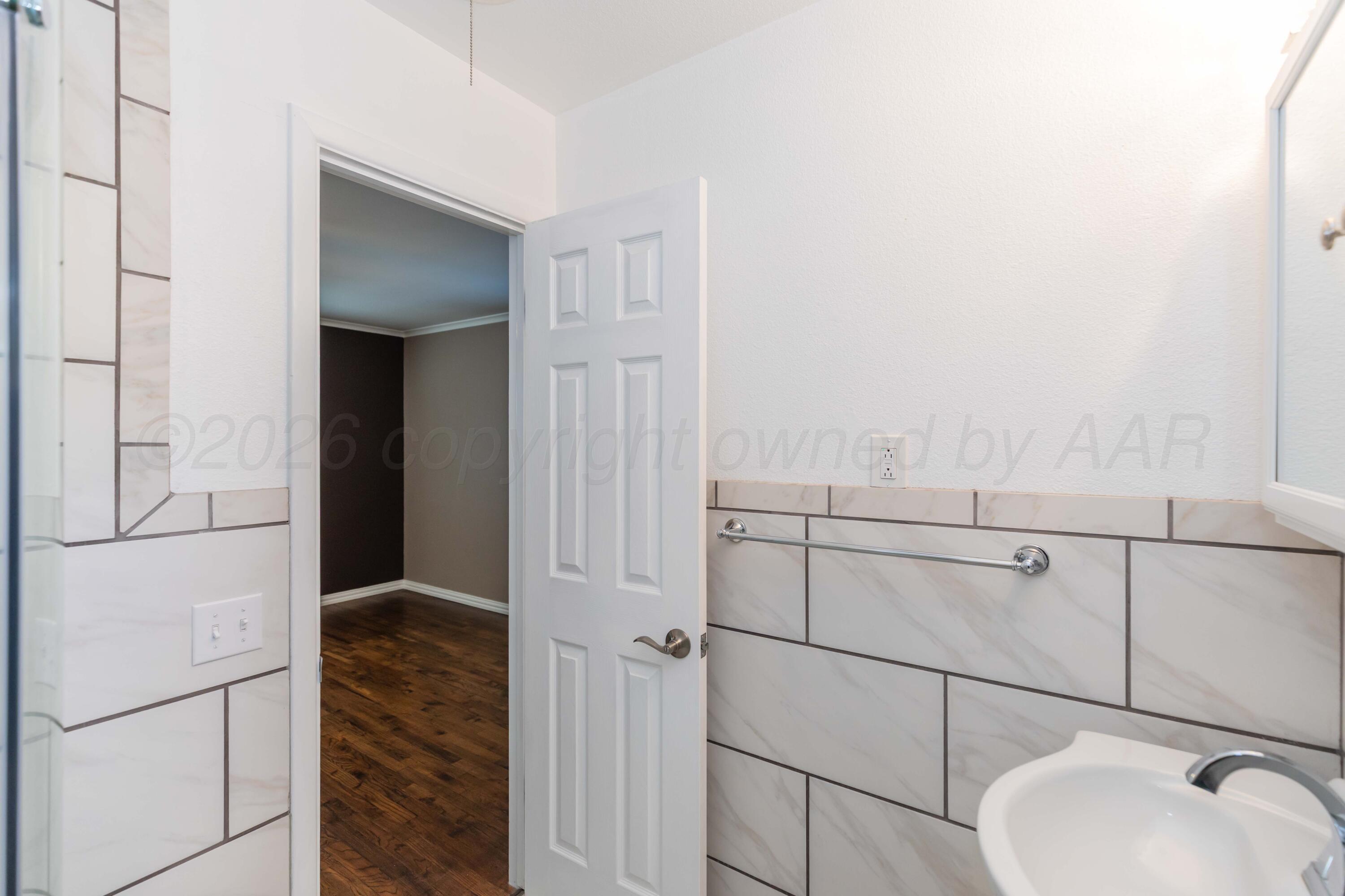 4309 Olsen Boulevard Amarillo, TX 79106 - Photo 26 of 45 a bathroom with a shower