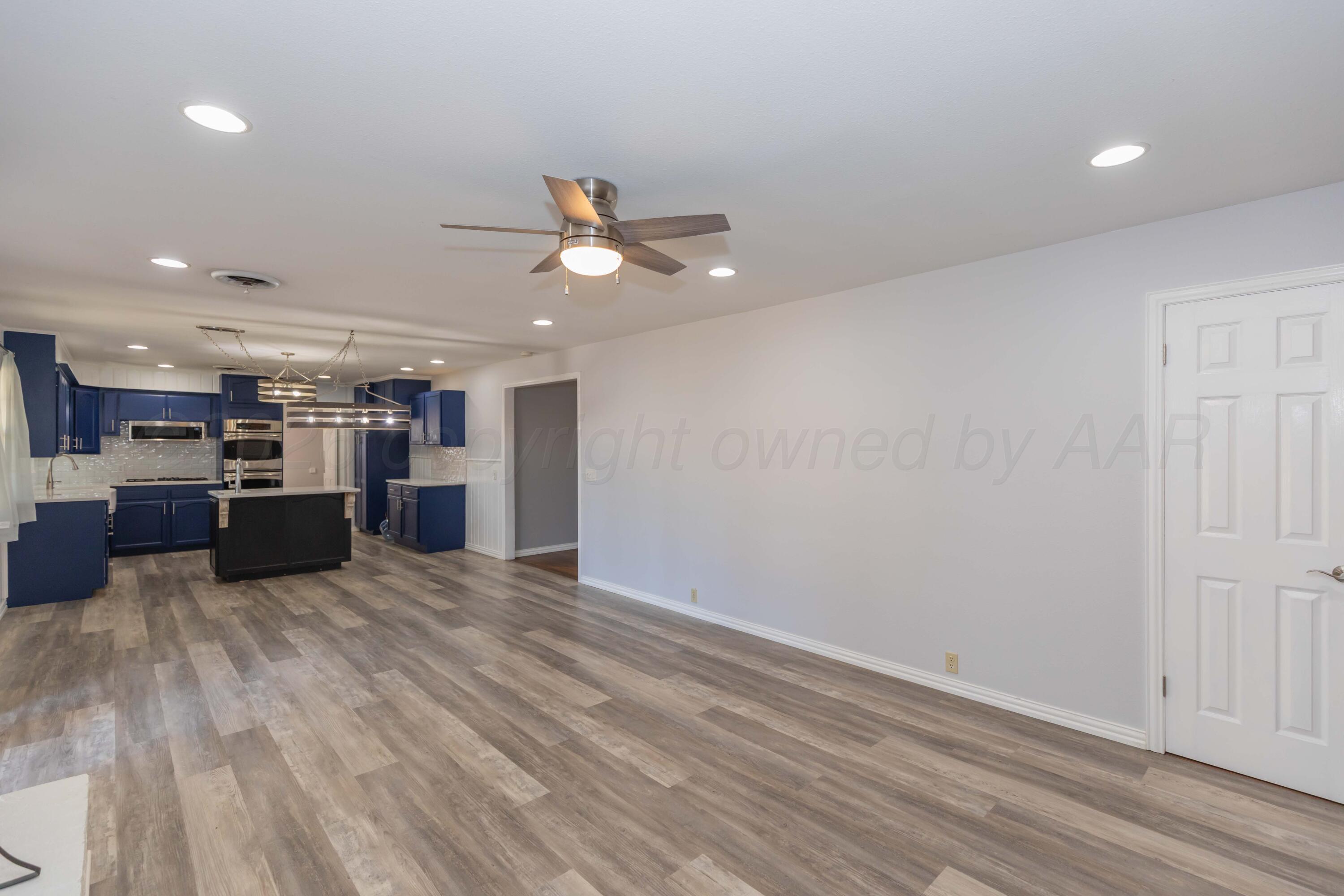 4309 Olsen Boulevard Amarillo, TX 79106 - Photo 3 of 45 a view of kitchen with cabinets and wooden floor