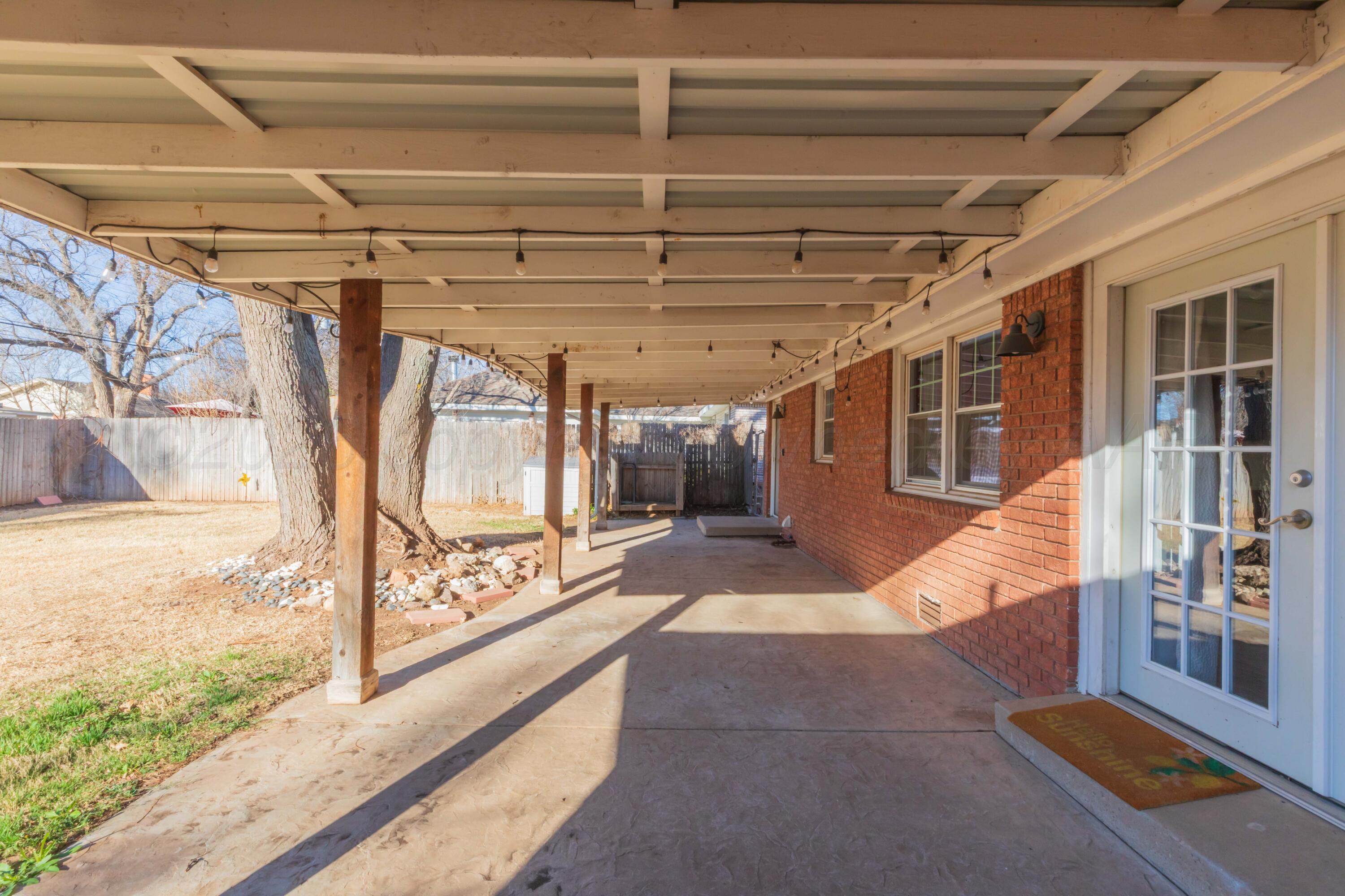4309 Olsen Boulevard Amarillo, TX 79106 - Photo 41 of 45 a view of a hallway with wooden floor and door