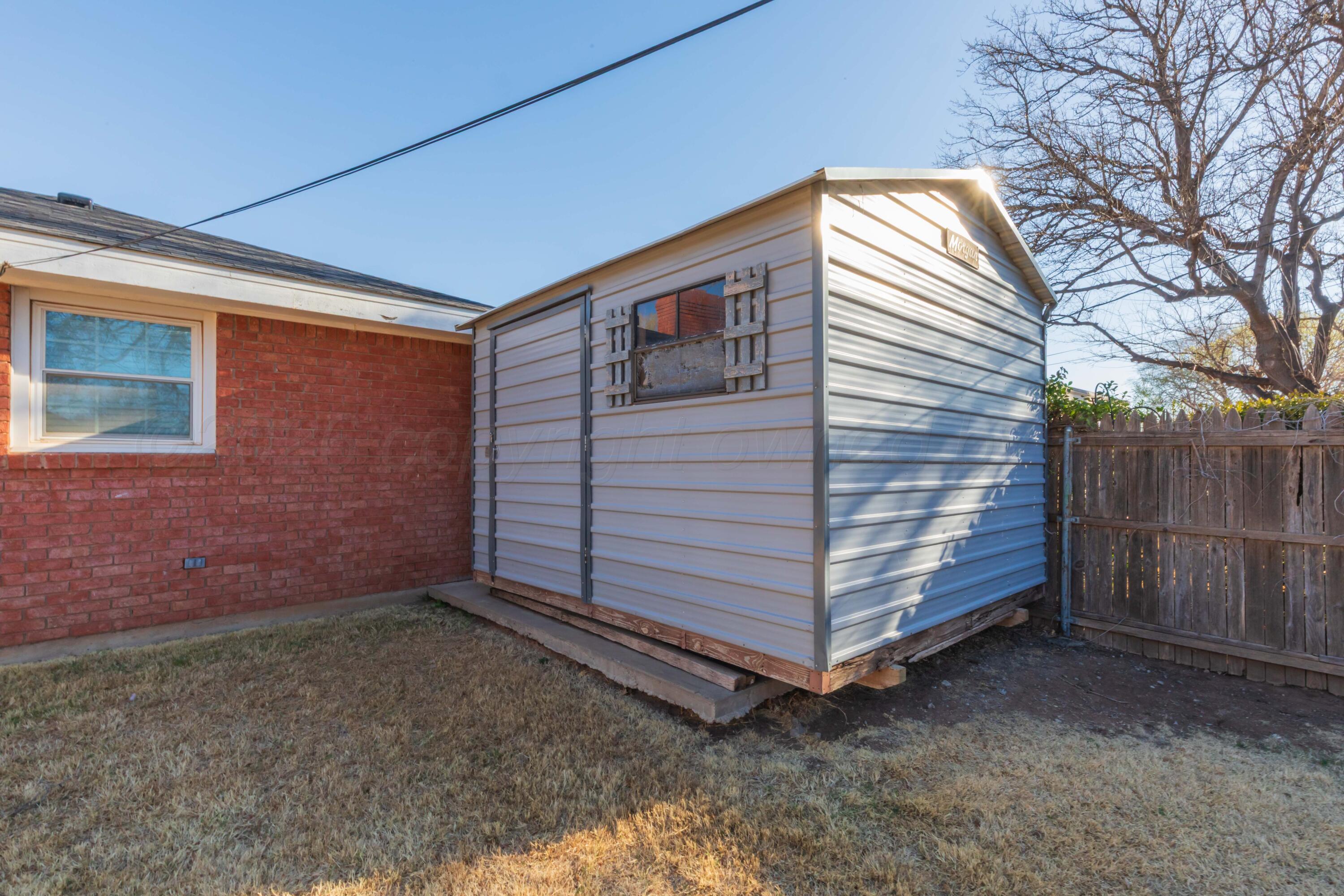 4309 Olsen Boulevard Amarillo, TX 79106 - Photo 43 of 45 a view of backyard with small cabin