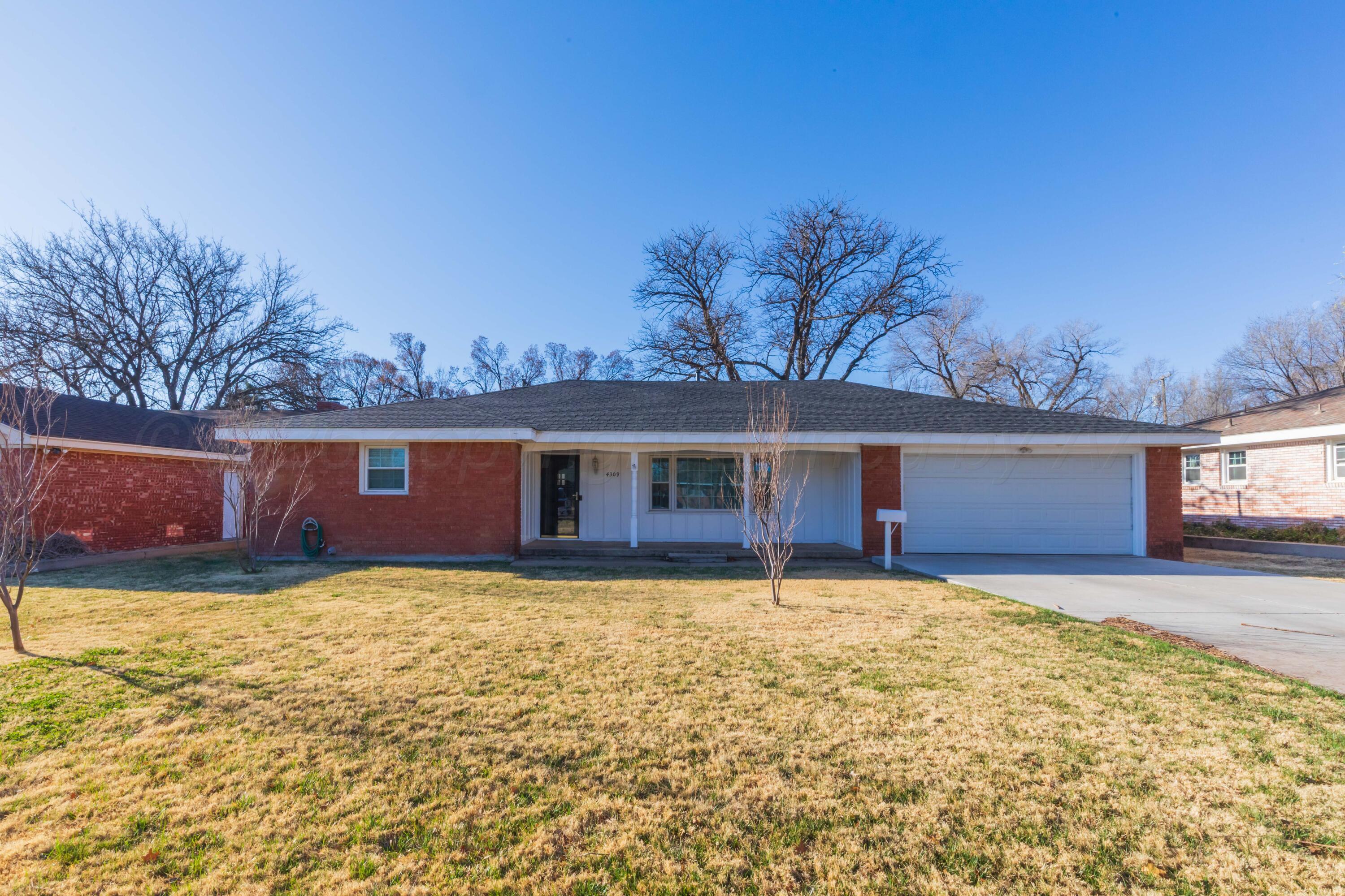 4309 Olsen Boulevard Amarillo, TX 79106 - Photo 45 of 45 front view of a house with yard