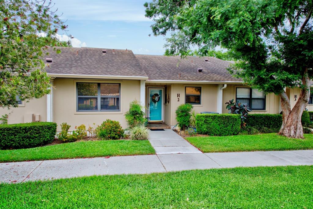 2025 Sylvester Road, Unit H2 Lakeland, FL 33803 - Photo 2 of 59 a front view of a house with a yard