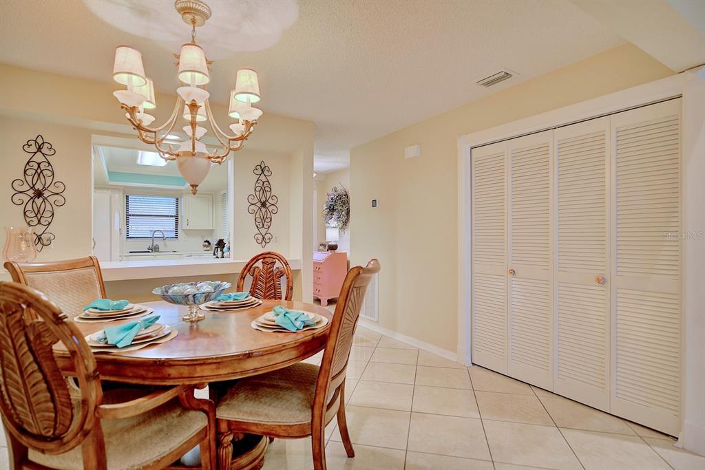 2025 Sylvester Road, Unit H2 Lakeland, FL 33803 - Photo 23 of 59 a view of a dining room with furniture and a chandelier