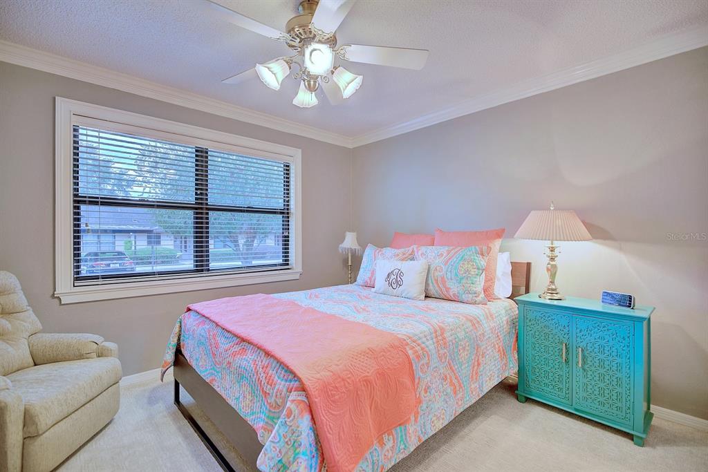 2025 Sylvester Road, Unit H2 Lakeland, FL 33803 - Photo 29 of 59 a bedroom with a bed and a couch