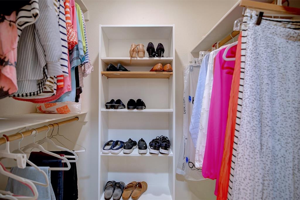 2025 Sylvester Road, Unit H2 Lakeland, FL 33803 - Photo 32 of 59 a view of walk in closet with clothes and shoes