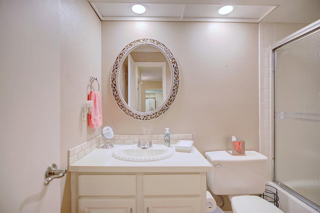 2025 Sylvester Road, Unit H2 Lakeland, FL 33803 - Photo 37 of 59 a bathroom with a sink and a mirror