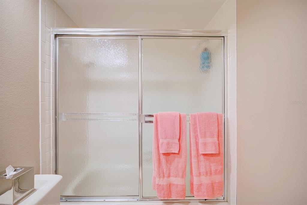 2025 Sylvester Road, Unit H2 Lakeland, FL 33803 - Photo 38 of 59 a bathroom with a shower curtain and a sink