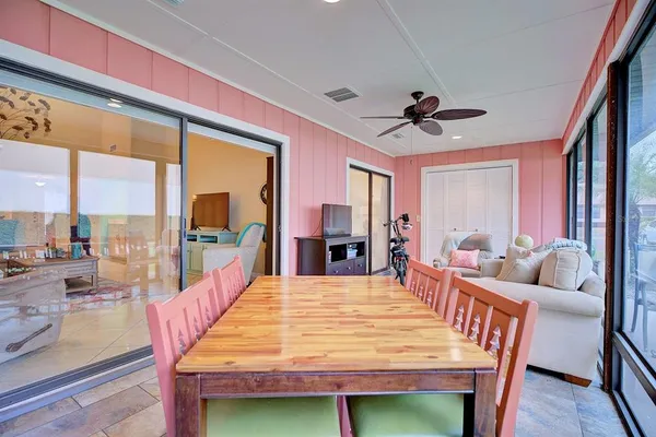 a view of a dining room with furniture window and wooden floor