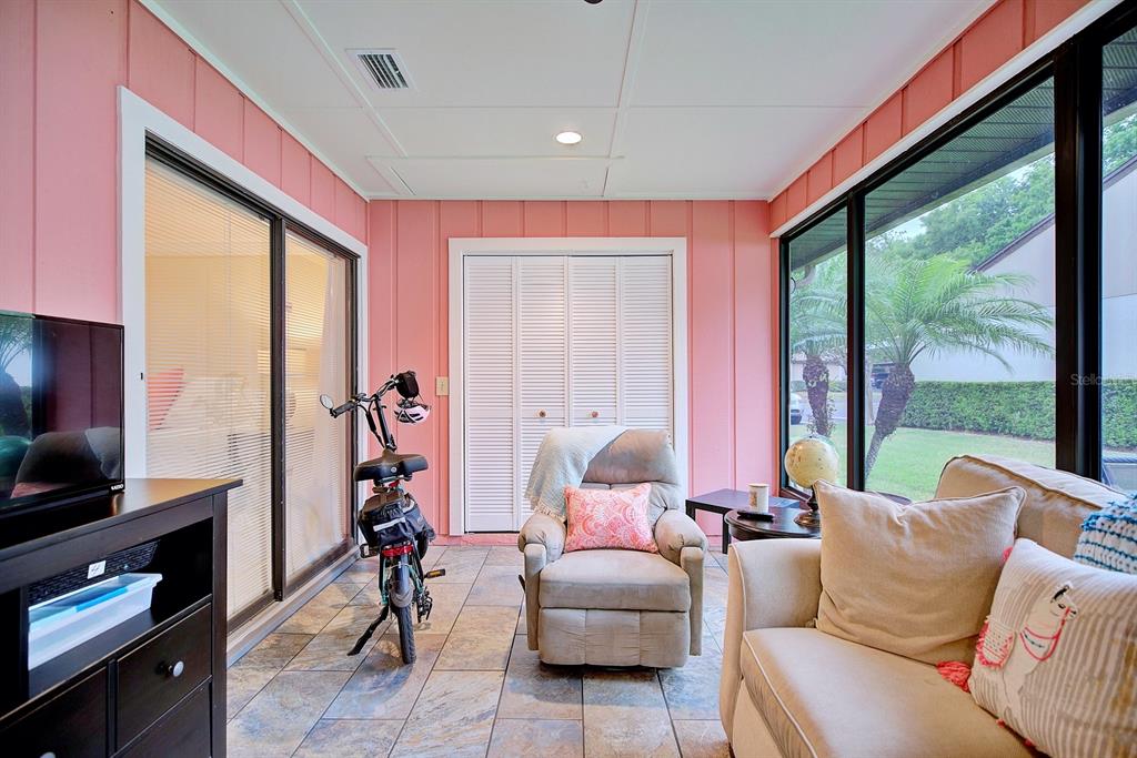 2025 Sylvester Road, Unit H2 Lakeland, FL 33803 - Photo 41 of 59 a living room with furniture and a flat screen tv