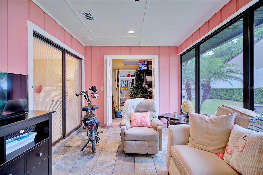 2025 Sylvester Road, Unit H2 Lakeland, FL 33803 - Photo 42 of 59 a living room with furniture and a flat screen tv