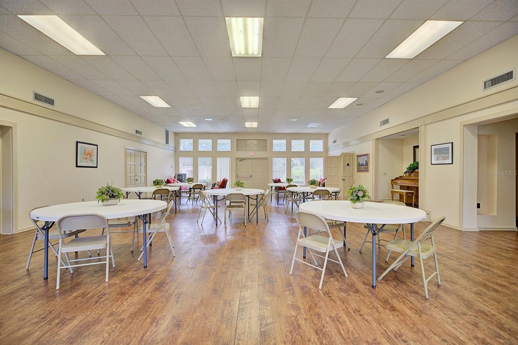 2025 Sylvester Road, Unit H2 Lakeland, FL 33803 - Photo 46 of 59 a view of a dining room with furniture window and wooden floor