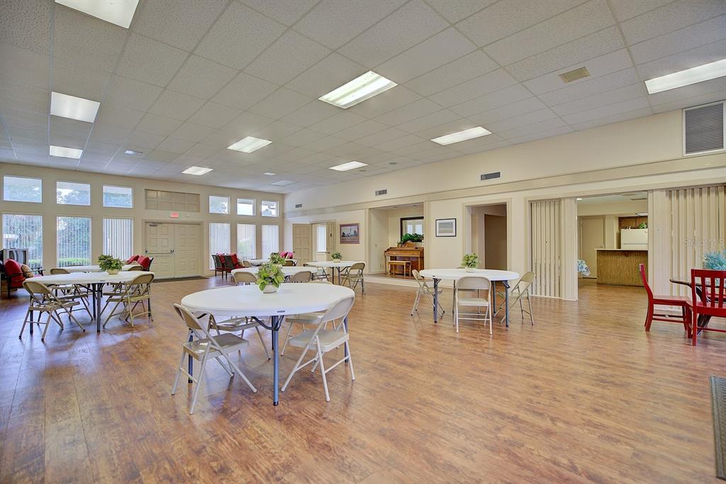 2025 Sylvester Road, Unit H2 Lakeland, FL 33803 - Photo 47 of 59 a view of a dining room with furniture window and wooden floor