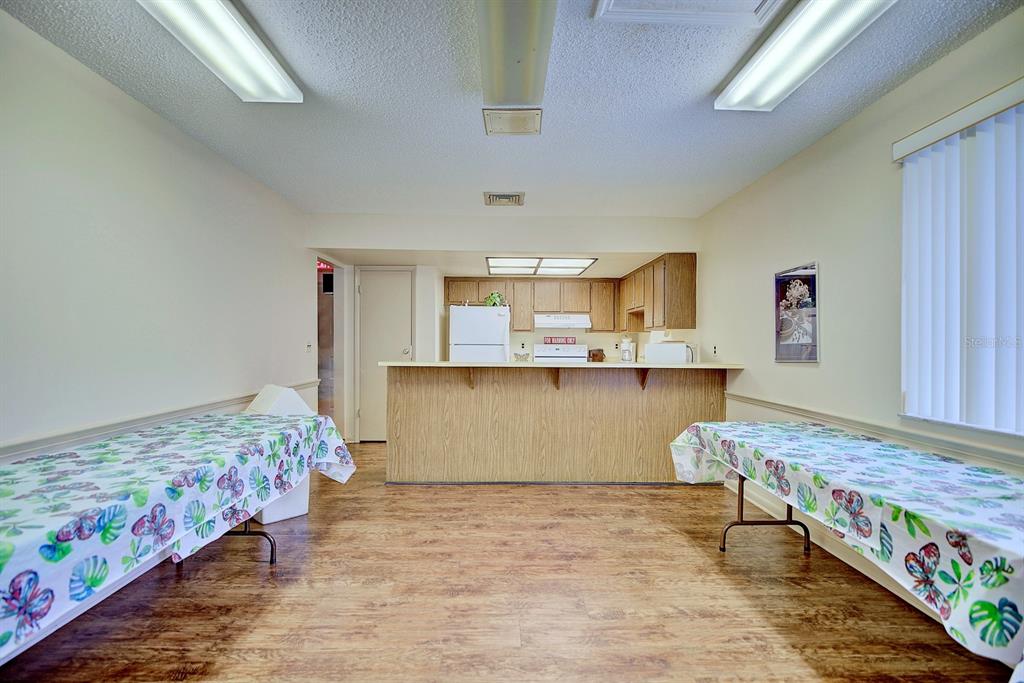 2025 Sylvester Road, Unit H2 Lakeland, FL 33803 - Photo 52 of 59 a room with kitchen island granite countertop furniture and a rug