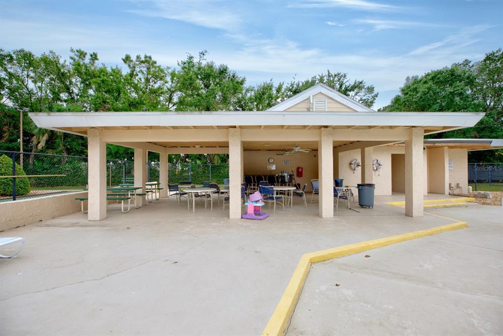 2025 Sylvester Road, Unit H2 Lakeland, FL 33803 - Photo 54 of 59 a view of a house with backyard porch and sitting area