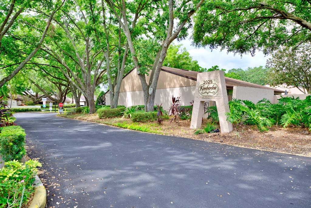 2025 Sylvester Road, Unit H2 Lakeland, FL 33803 - Photo 59 of 59 a view of a house with a yard and large trees