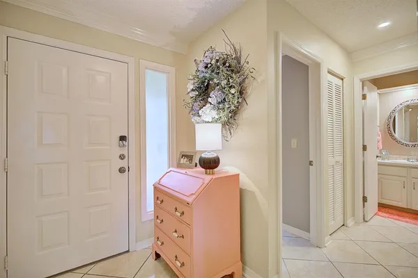 a kitchen with cabinets appliances a sink and a window