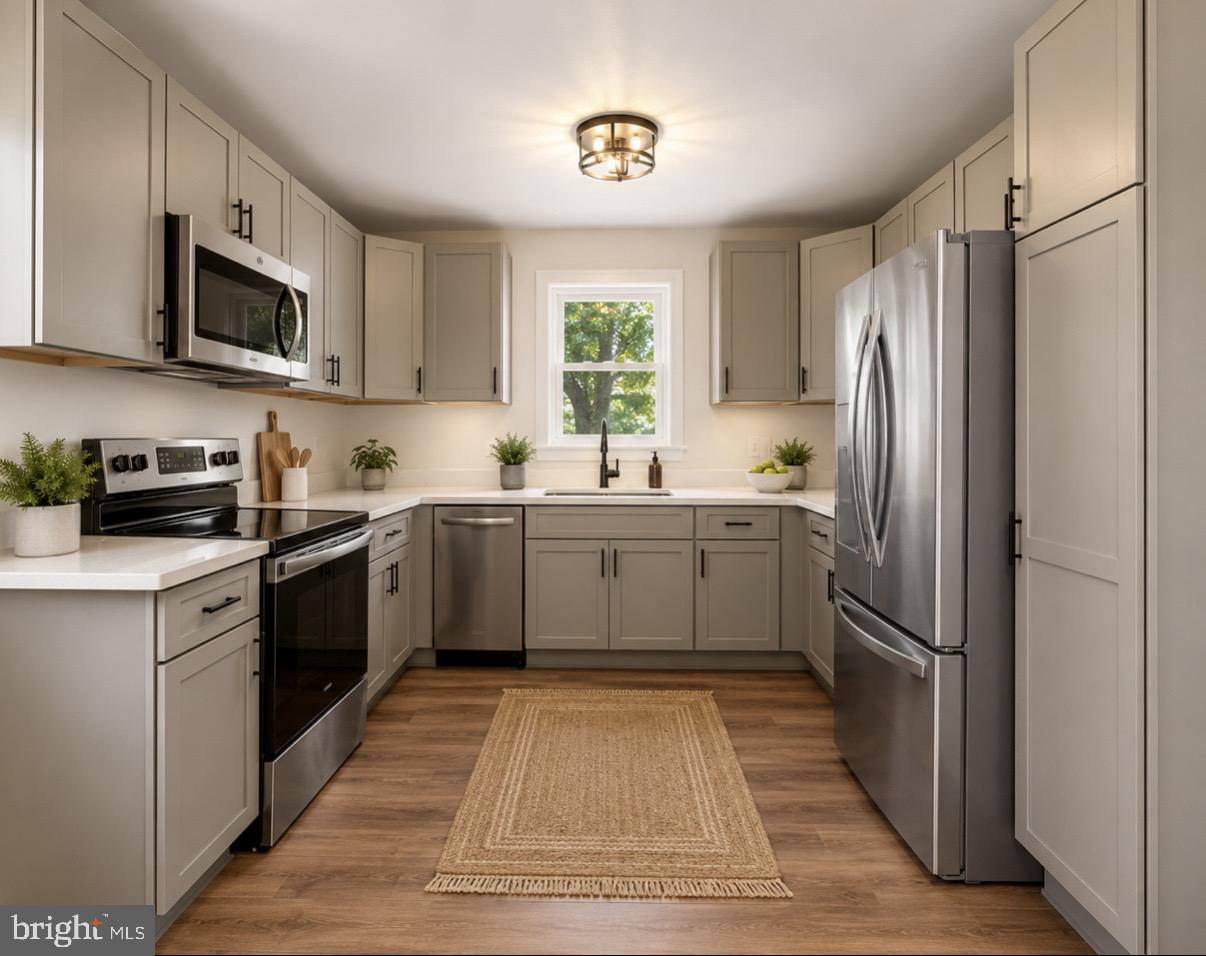 12 Oak Street Cambridge, MD 21613 - Photo 2 of 30 Modern kitchen with sleek finishes.