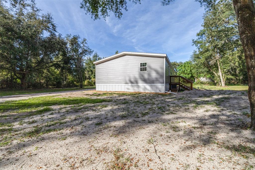 892 Southwest 124th Lane Webster, FL 33597 - Photo 21 of 29 a view of a house with backyard