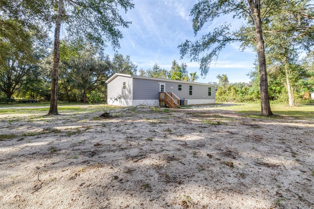892 Southwest 124th Lane Webster, FL 33597 - Photo 23 of 29 a view of outdoor space with playground and green space