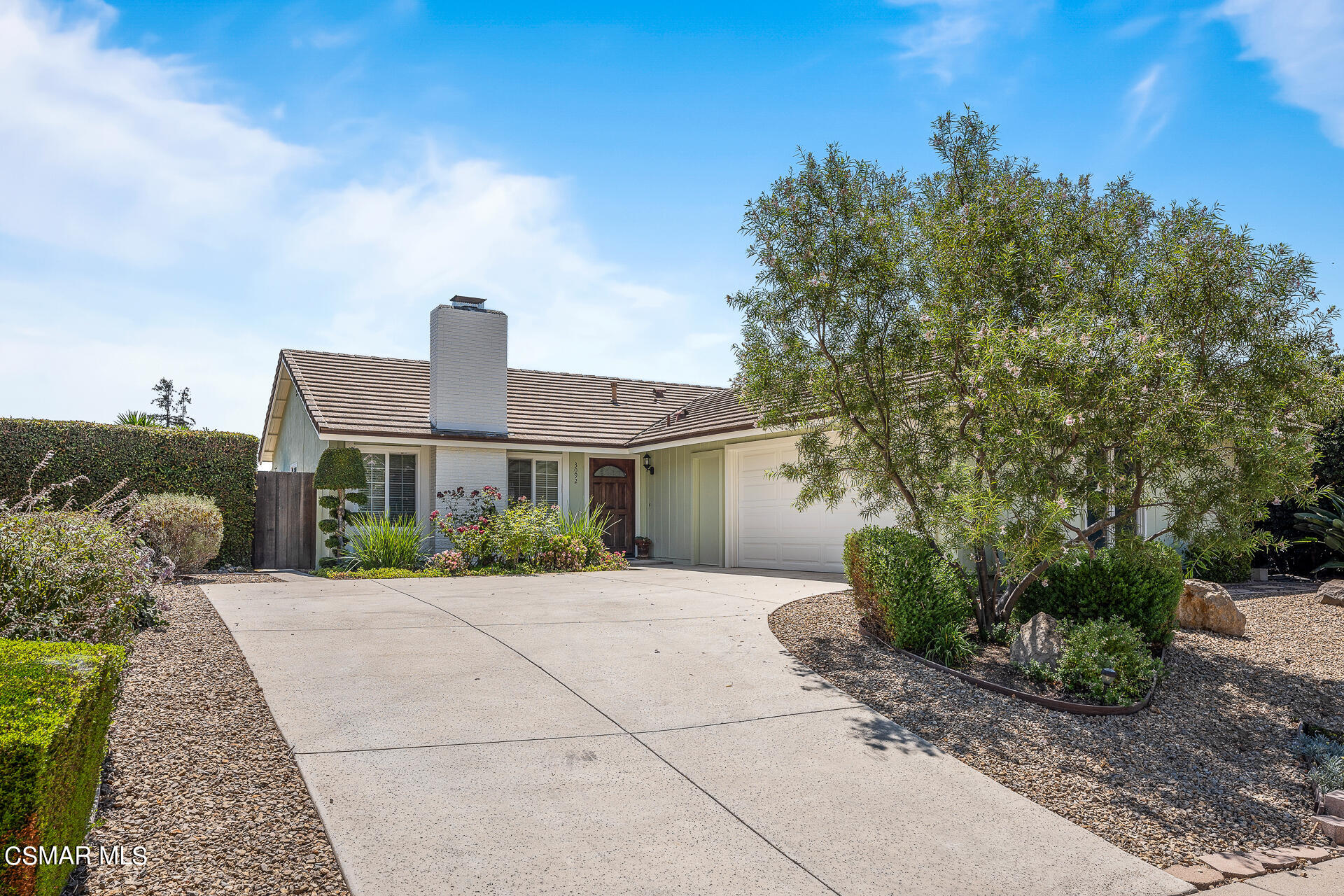 3092 Big Sky Drive Thousand Oaks, CA 91360 - Photo 15 of 66 a front view of a house with garden