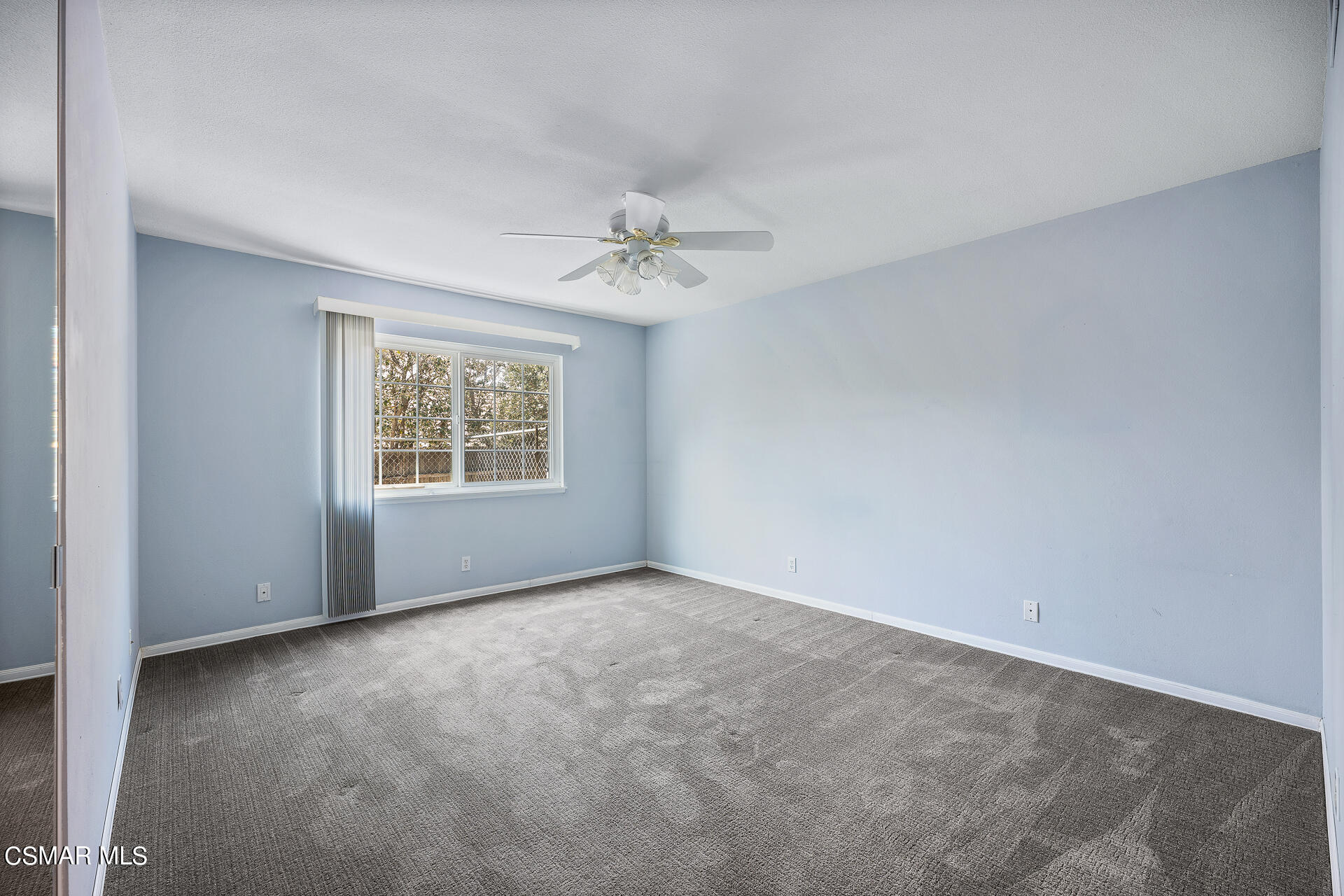 3092 Big Sky Drive Thousand Oaks, CA 91360 - Photo 8 of 66 an empty room with windows and chandelier fan