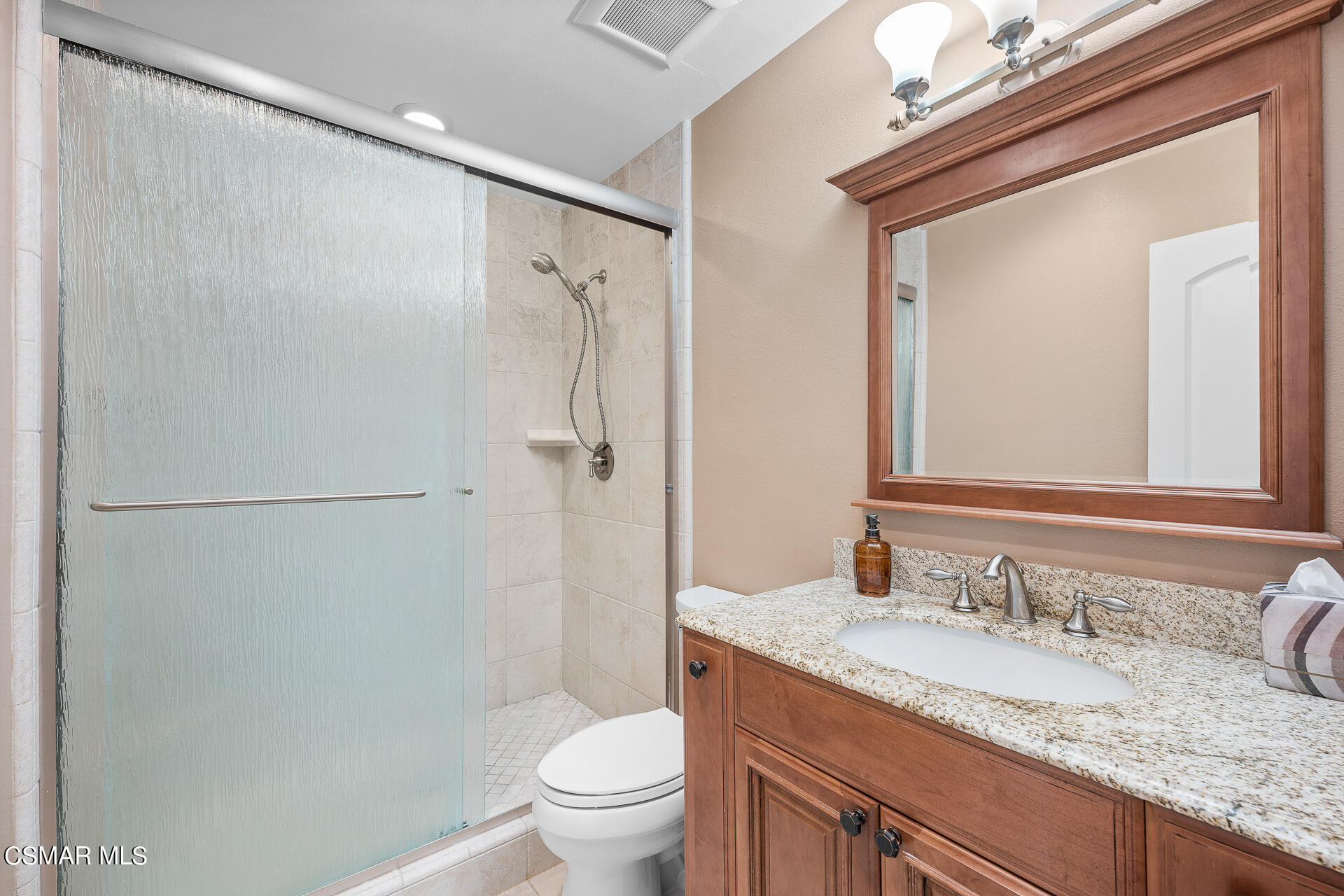 3092 Big Sky Drive Thousand Oaks, CA 91360 - Photo 9 of 66 a bathroom with a granite countertop sink toilet and shower