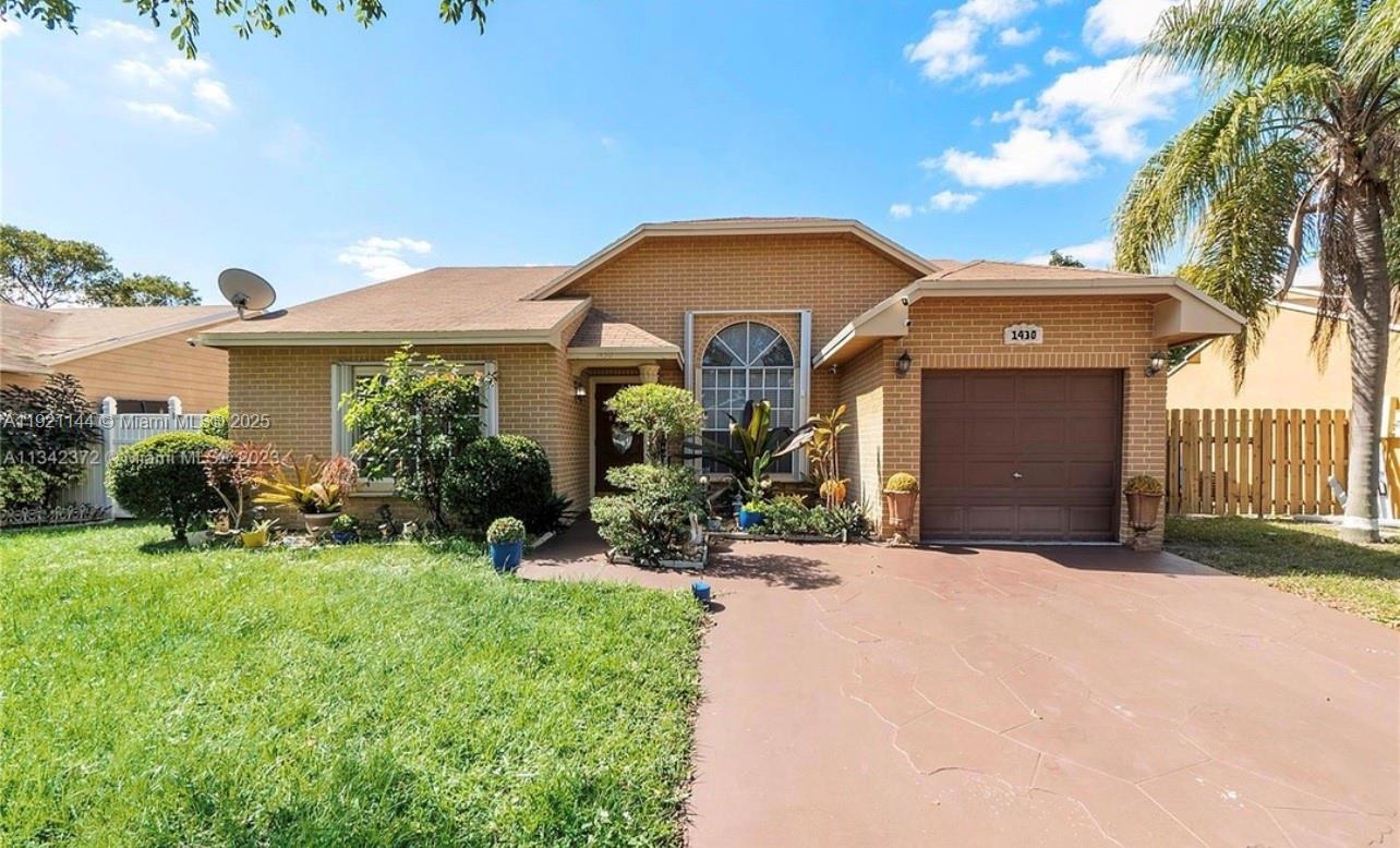 a front view of a house with yard and outdoor seating