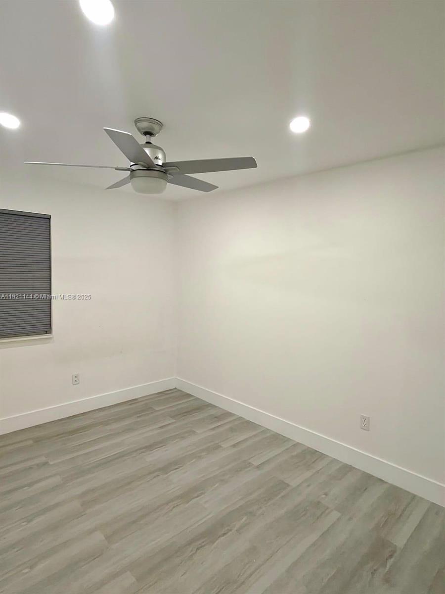 1430 Southwest 85th Terrace Pembroke Pines, FL 33025 - Photo 15 of 27 wooden floor in a empty room