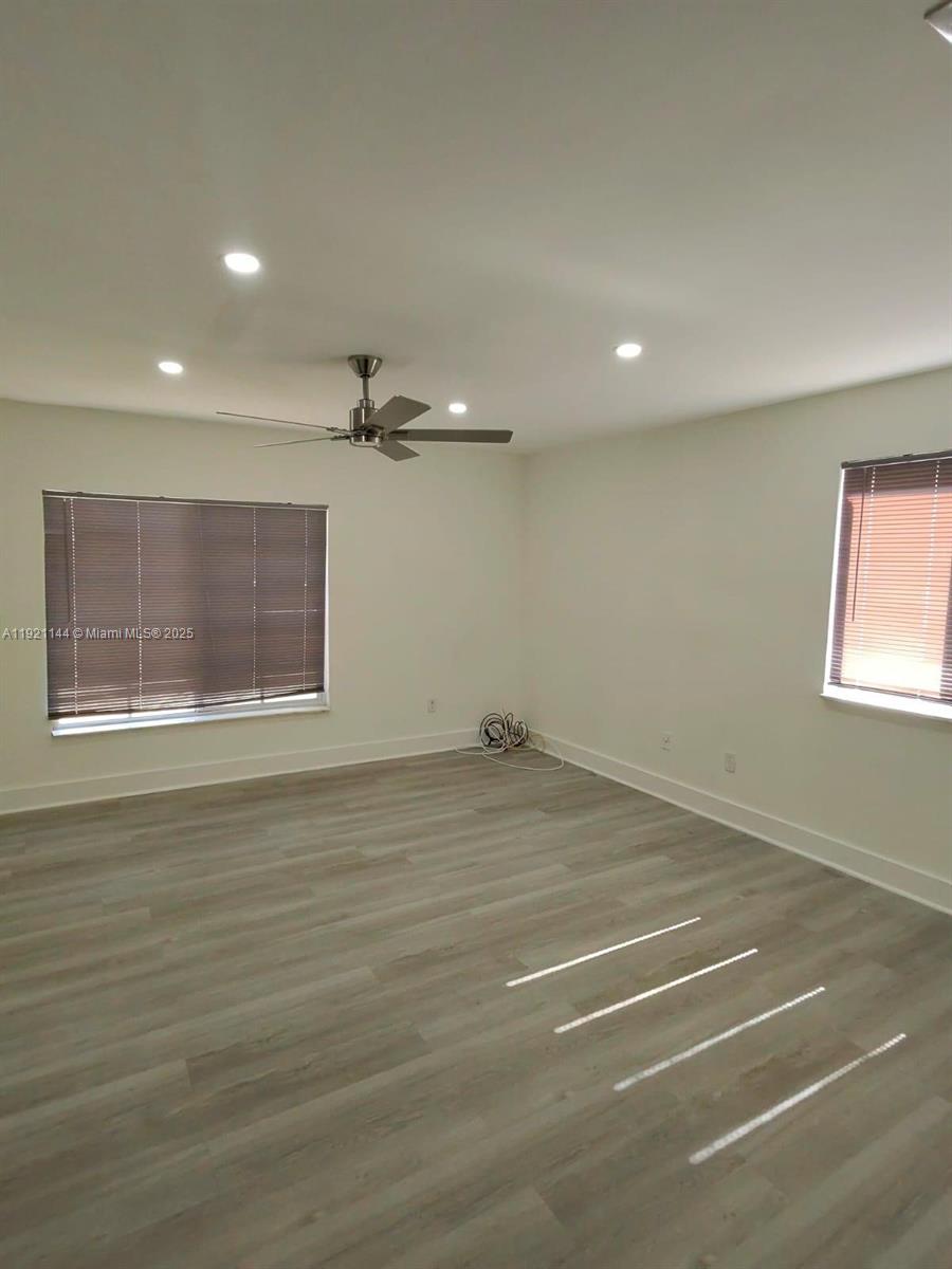 1430 Southwest 85th Terrace Pembroke Pines, FL 33025 - Photo 16 of 27 an empty room with a empty space and windows