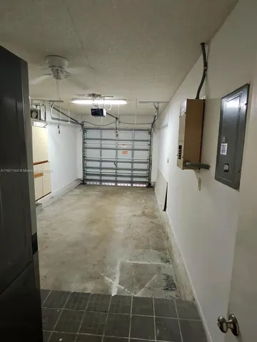 a kitchen with a refrigerator and a stove