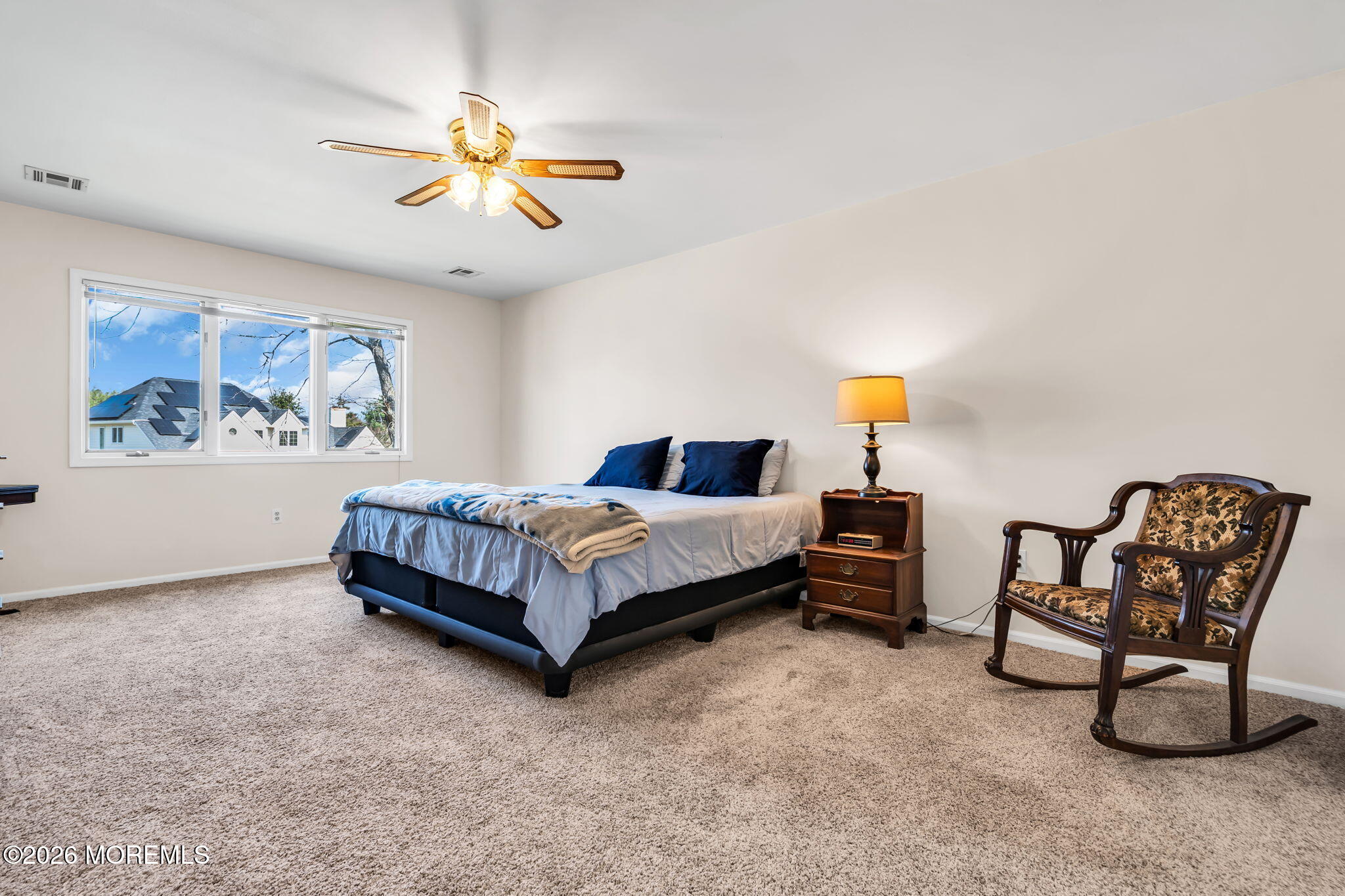 250 Bent Hook Road Toms River, NJ 08755 - Photo 32 of 63 a bedroom with a bed and a chandelier